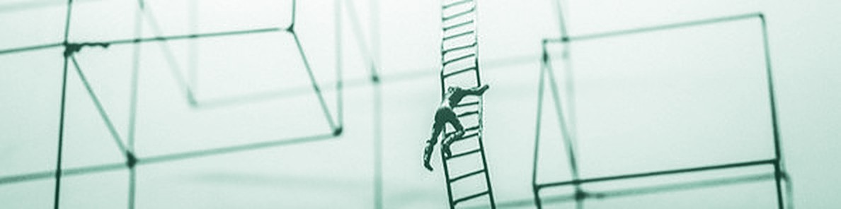 A tiny figure climbs a ladder between empty wire frames